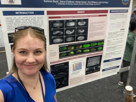 Picture of Summer Blunk in front of her poster at the Southwest Regional Meeting of the Society of Developmental Biology