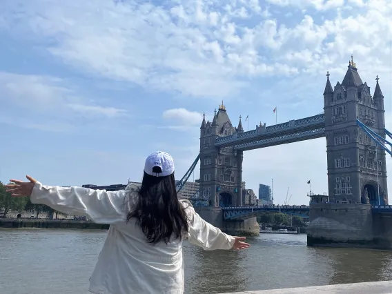 Chloe posing in front of the London Bridge