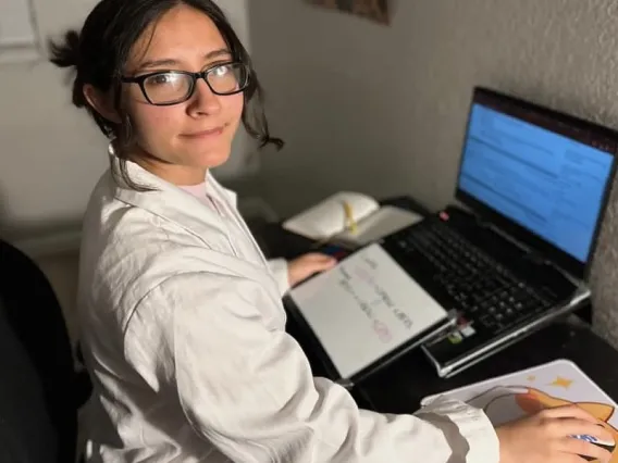 Picture of Jessica sitting in front of her computer