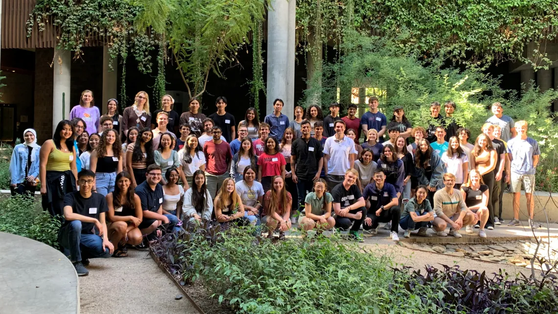 Summer 2023 UBRP students standing in the courtyard of the ENR2 Building