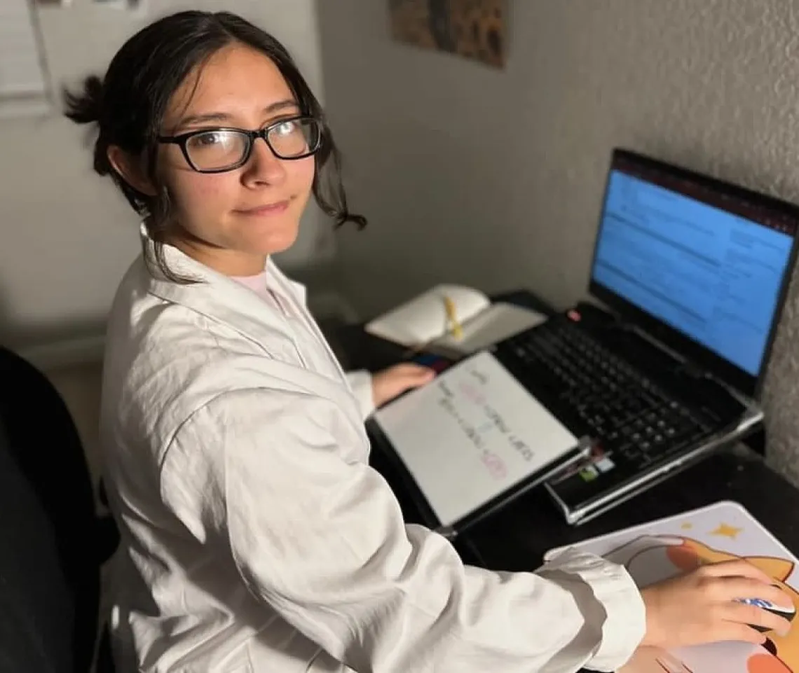 Picture of Jessica sitting in front of her computer