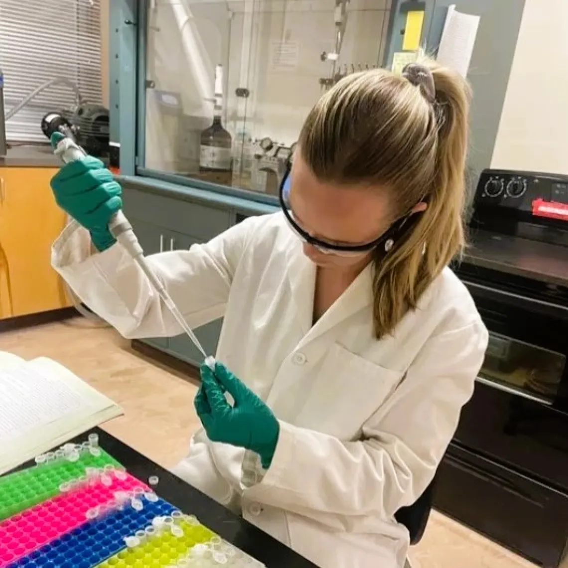 Picture of Paige using a pipette to fill a vial